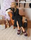 <p>Molly Sims cozies up at home in a pair of Dearfoams slippers on Dec. 5 in L.A. </p>