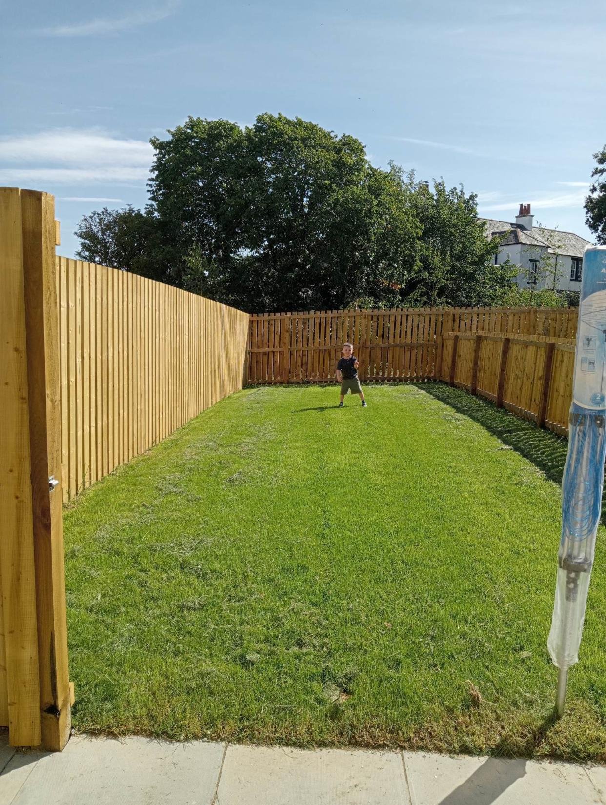 Ayrshire family bogged down after garden turns to marshland, with Ellis Reid and partner Douglas Horn left furious by state of backdoor

Pictured: The garden in August