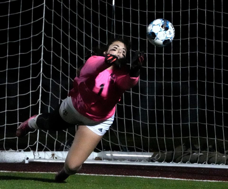 Toll Gate goalie Alanna Pereira dives to deflect a shot at goal in the second half of Div 3 championship game play.