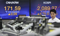 A currency trader watches monitors at the foreign exchange dealing room of the KEB Hana Bank headquarters in Seoul, South Korea, Tuesday, July 16, 2019. Asian shares were little changed and mixed in quiet trading Tuesday amid a lack of fresh market-moving news as investors looked ahead to earnings season. (AP Photo/Ahn Young-joon)