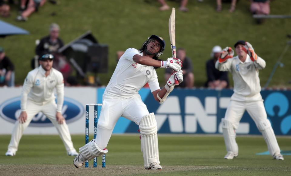 India's Ishant Sharma plays a shot against New Zealand during the first innings on day one of the second international test cricket match at the Basin Reserve in Wellington, February 14, 2014.