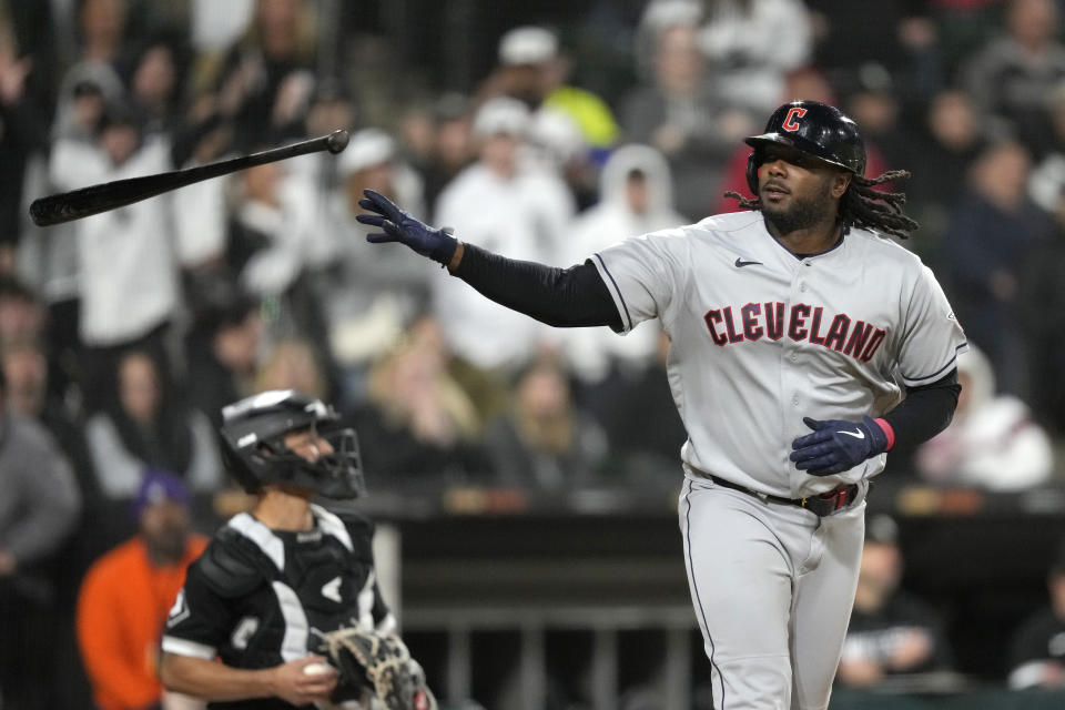 Cleveland Guardians' Josh Bell tosses his bat after drawing a walk from Chicago White Sox relief pitcher Reynaldo Lopez, with the bases loaded in the seventh inning of a baseball game Wednesday, May 17, 2023, in Chicago. (AP Photo/Charles Rex Arbogast)