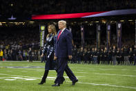 President Donald Trump and first lady Melania Trump arrive for the College Football Playoff National Championship game between LSU and Clemson, Monday, Jan. 13, 2020, in New Orleans. (AP Photo/ Evan Vucci)