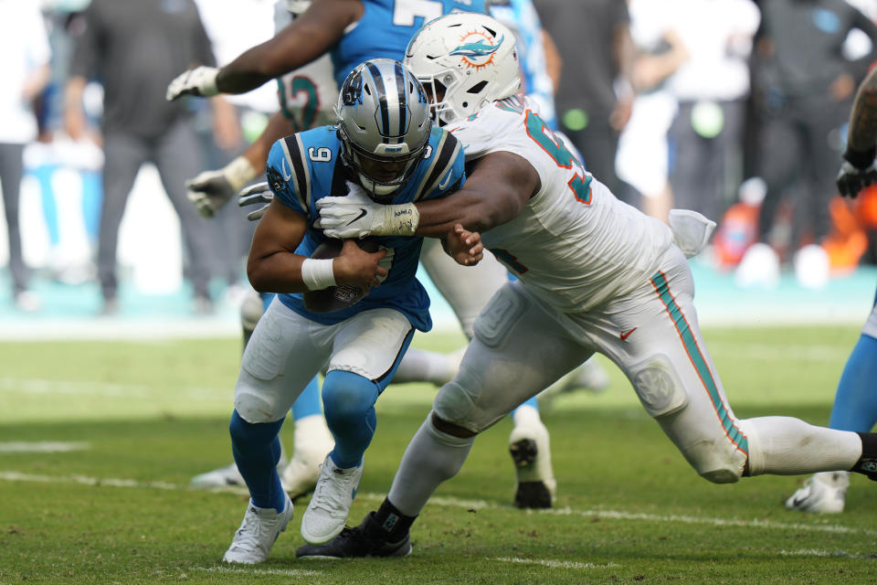 Miami Dolphins defensive tackle Christian Wilkins (94) sacks Carolina Panthers quarterback Bryce Young (9) during the second half of an NFL football game, Sunday, Oct. 15, 2023, in Miami Gardens, Fla. (AP Photo/Wilfredo Lee)