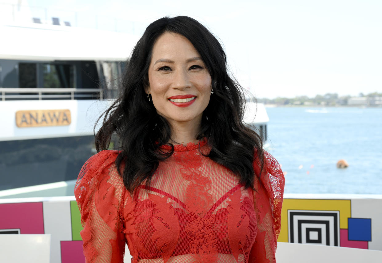Lucy Liu rocked a hot pink suit at an event in New York on Tuesday. (Photo by Michael Kovac/Getty Images for IMDb)