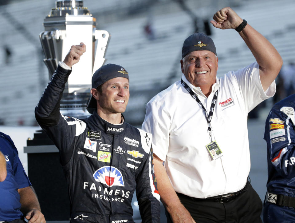 FILE - Kasey Kahne, left, celebrates with car owner Rick Hendrick after winning the NASCAR Brickyard 400 auto race at Indianapolis Motor Speedway in Indianapolis Sunday, July 23, 2017. Rick Hendrick and Hendrick Motorsports are marking the 40th anniversary of NASCAR’s winningest team.(AP Photo/AJ Mast, File)