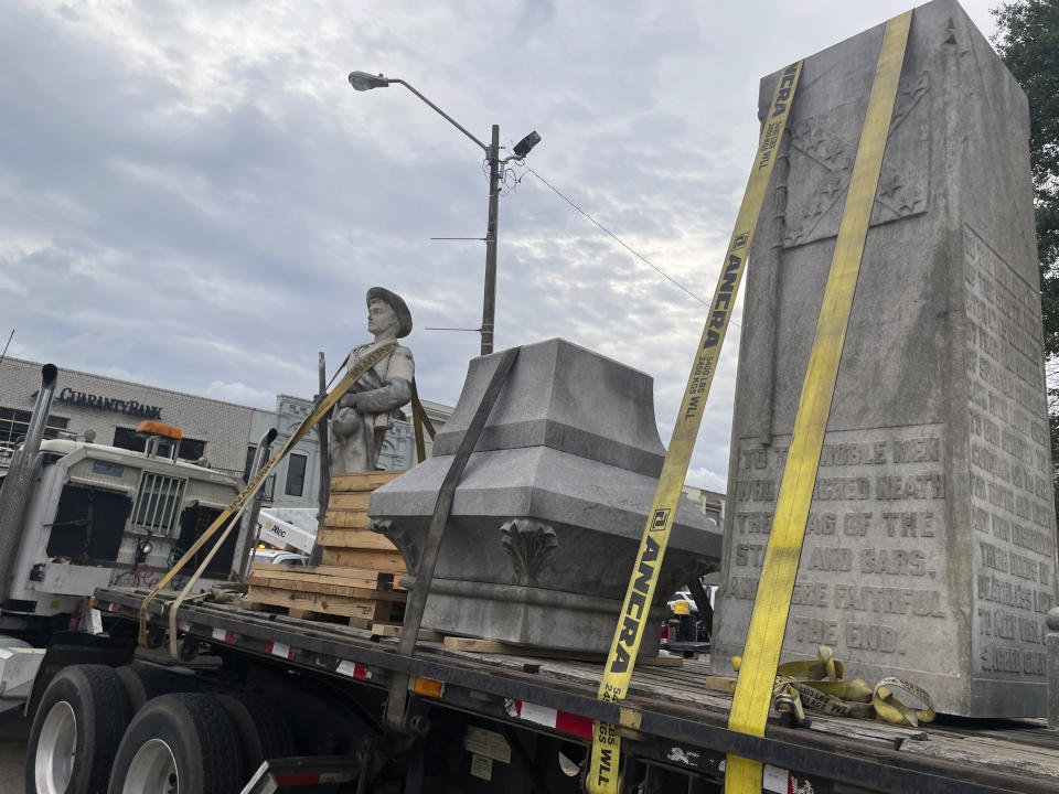 Pieces of a Confederate monument are secured onto a flatbed truck Wednesday, Sept. 11, 2024, after a crew removed them from the spot where the monument had stood since 1910, in downtown Grenada, Miss. (AP Photo/Emily Wagster Pettus)