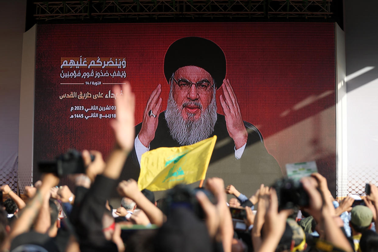 Lebanon's Hezbollah leader Sayyed Hassan Nasrallah appears on a screen as he addresses his supporters during a ceremony to honour fighters killed in the recent escalation with Israel, in Beirut's southern suburbs, Lebanon November 3, 2023. REUTERS/Mohamed Azakir