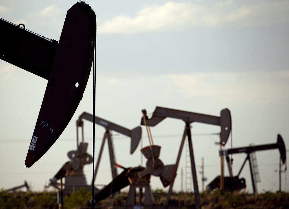 FILE - In this April 24, 2015, file photo, pumpjacks work in a field near Lovington, N.M. President Joe Biden shut down oil and gas lease sales from the nation's vast public lands and waters in his first days in office, citing worries about climate change. Now his administration has to figure out what do with the multi-billion dollar program without crushing a significant sector of the U.S. economy, while fending off sharp criticism from congressional Republicans and the oil industry. (AP Photo/Charlie Riedel, File)