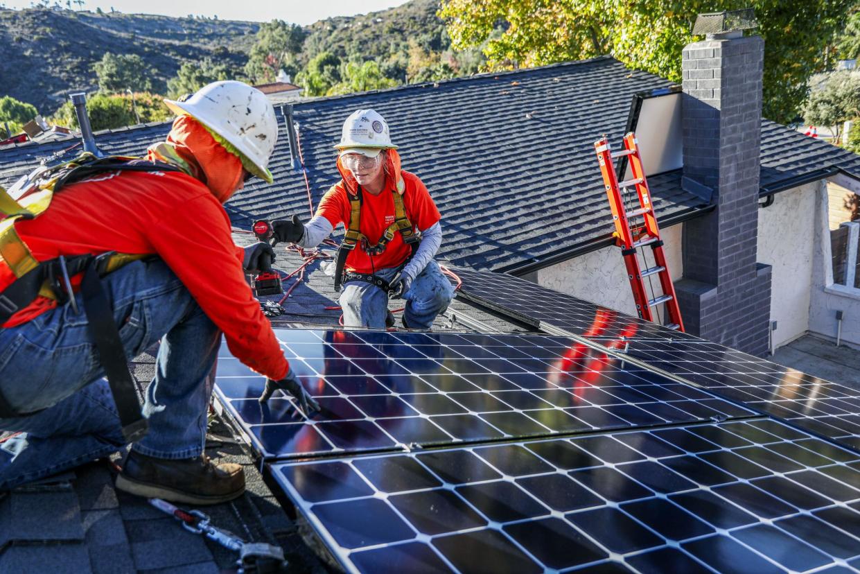 <span>The deputy administrator of the EPA said the investment will ‘generate more than $8bn in savings on electric bills for the overburdened households’.</span><span>Photograph: Sandy Huffaker/Bloomberg via Getty Images</span>