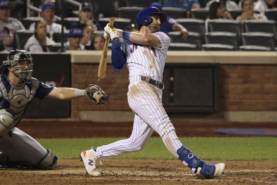 New York Mets' Jeff McNeil follows through on an RBI triple during the eighth inning of the team's baseball game against the Seattle Mariners, Saturday, Sept. 2, 2023, in New York. (AP Photo/Jason DeCrow)