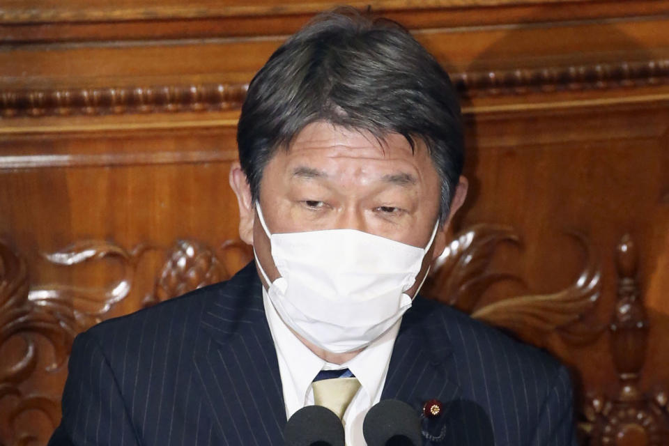 Japanese Foreign Minister Toshimitsu Motegi delivers a speech during an upper house plenary session at the parliament in Tokyo Monday, Jan. 18, 2021. Motegi blamed South Korea for further deteriorating their already strained relations by allegedly making illegal compensation demands over wartime sexual abuse of Korean women and use of forced laborers, urging Seoul to drop the case and fix the “abnormal development.” (Kyodo News via AP)