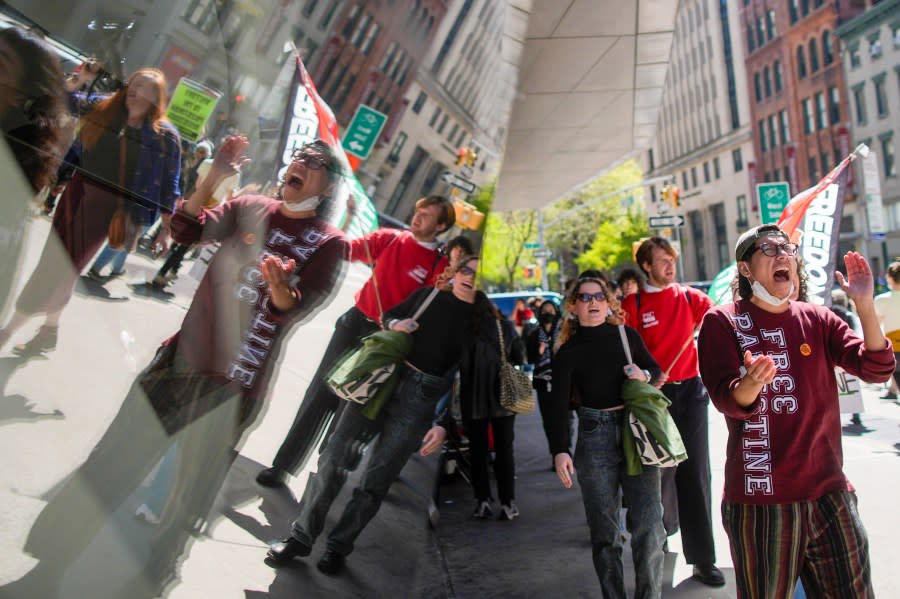 The New School students and pro-Palestinian supporters rally outside The New School University Center building, Monday, April 22, 2024, in New York. (AP Photo/Mary Altaffer)