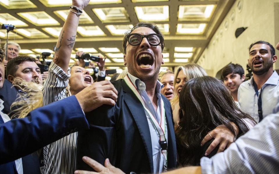 Staff members of Brothers of Italy celebrate the election result in Rome - Alessandra Benedetti/Corbis/Getty Images