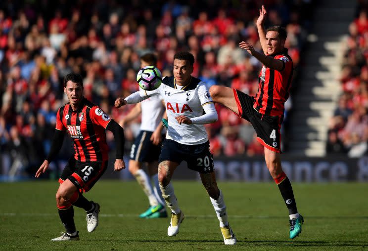 Dan Gosling of Bournemouth and Delle Alli compete for the ball