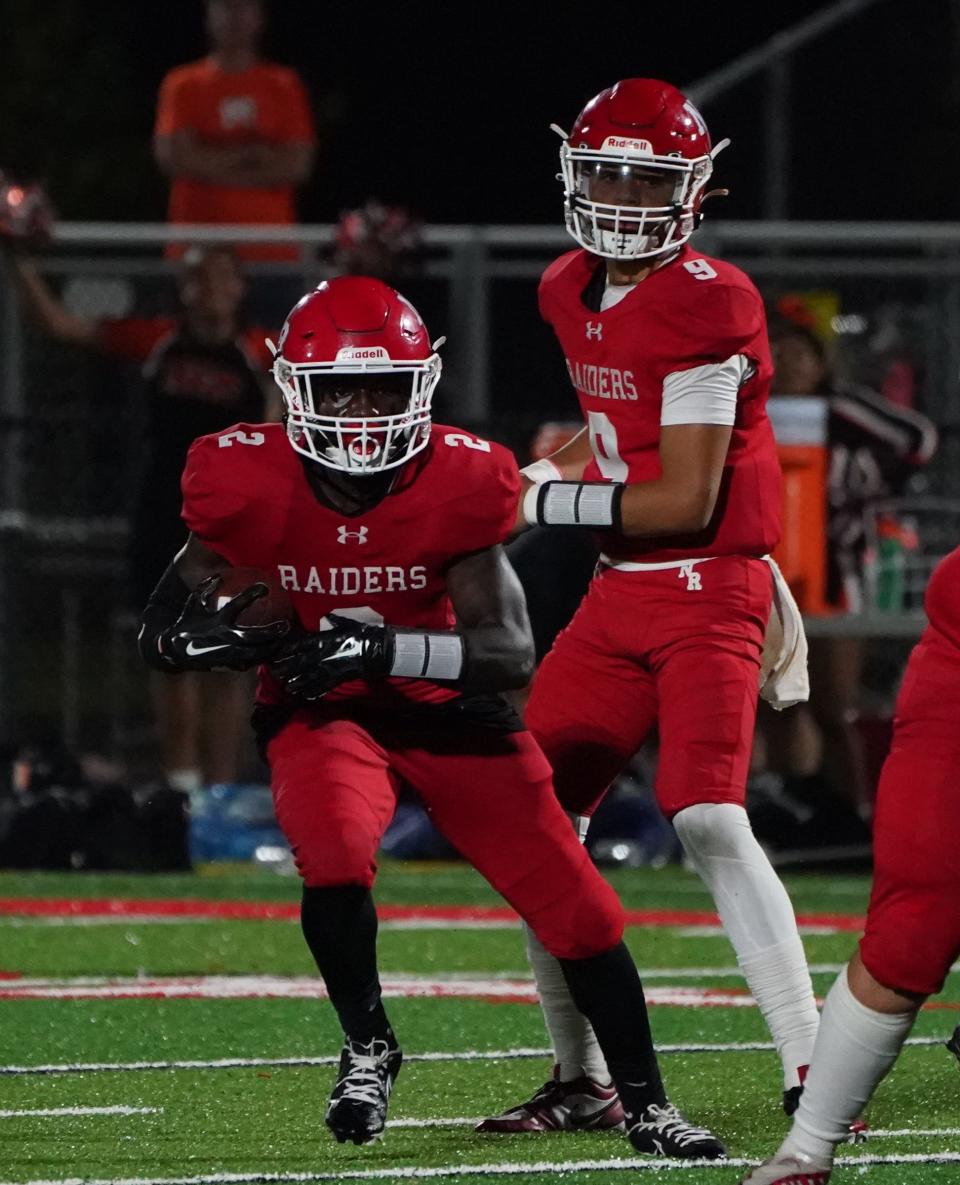 North Rockland quarterback Anthony Hamilton (9) hands off to Gamaliel Sauveur (2) during their 39-23 win over Mamaroneck at the Town of Haverstraw Sports Complex on Friday, September 8, 2023.