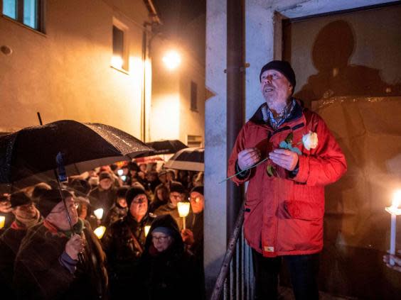 Aldo Rolfi speaks to participants of a demonstration against antisemitism (AFP via Getty Images)