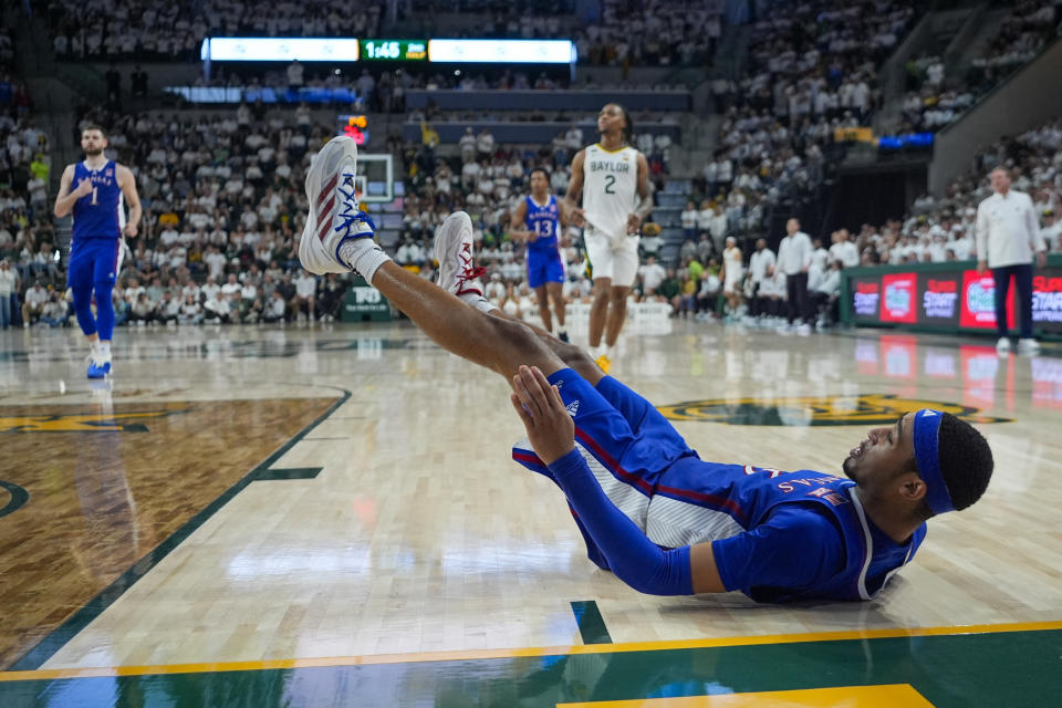 Kansas's Dajuan Harris Jr. falls back after missing a shot against Baylor during the second half of an NCAA college basketball game, Saturday, March 2, 2024, in Waco, Texas. Baylor won 82-74. (AP Photo/Julio Cortez)
