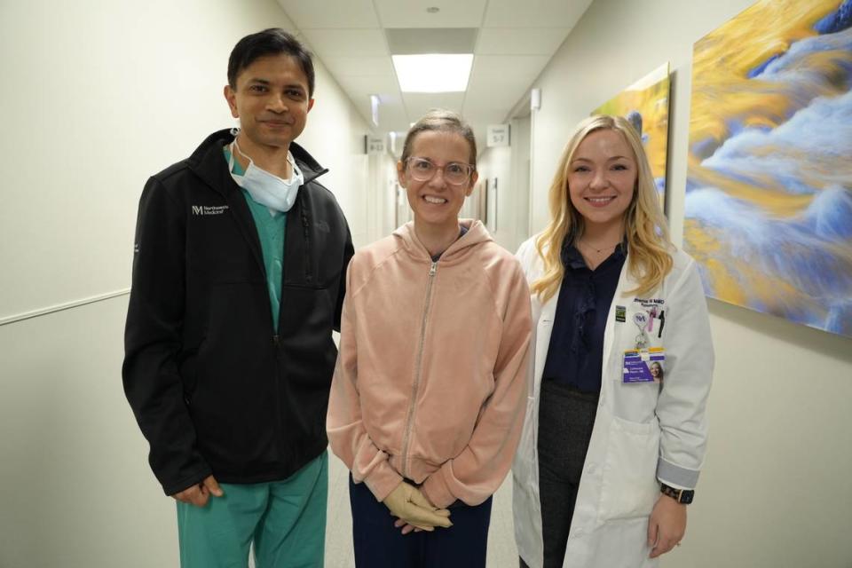 Dr. Ankit Bharat, chief of thoracic surgery and director of the Canning Thoracic Institute, Emily Presley and Dr. Catherine Myers, a pulmonologist with the Canning Thoracic Institute take a photo at the Northwestern Memorial Hospital in Chicago.