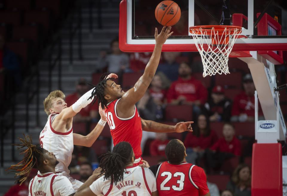 Ohio State's Brice Sensabaugh shoots as he is defended by Nebraska's Sam Griesel, left, during the first half of an NCAA college basketball game Wednesday, Jan. 18, 2023, in Lincoln, Neb. (Justin Wan/Lincoln Journal Star via AP)