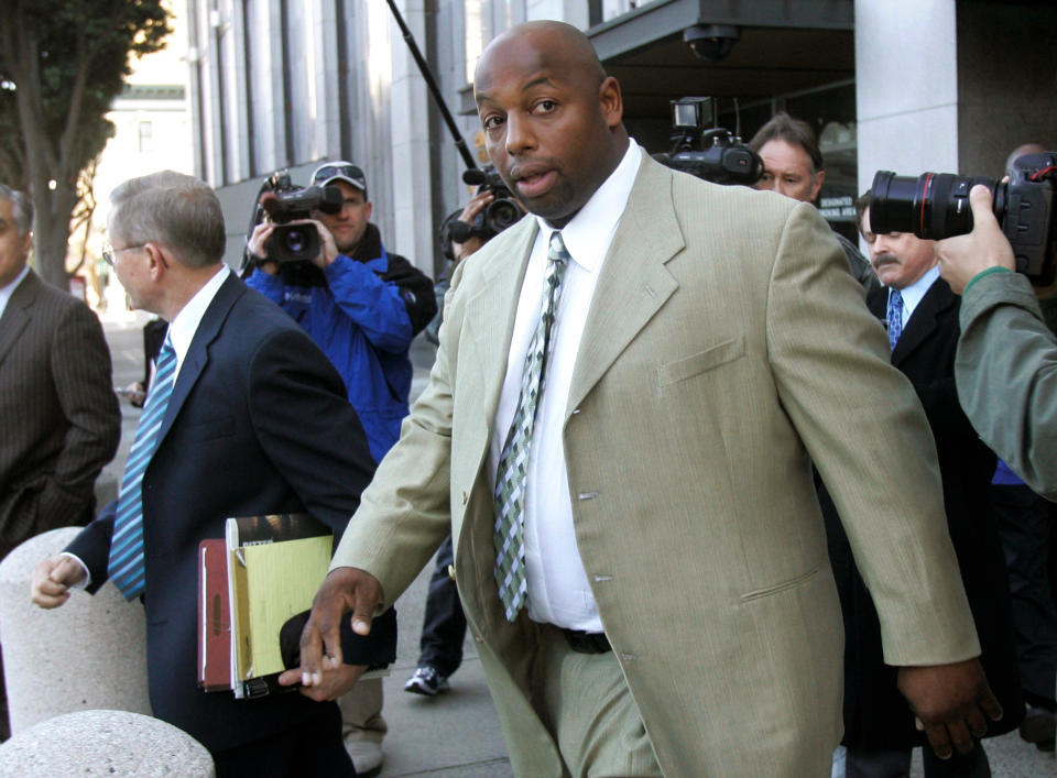 FILE - In this Jan. 18, 2008, file photo, former NFL football player Dana Stubblefield leaves a federal courthouse in San Francisco. Stubblefield was sentenced to 15 years to life in prison, Thursday, Oct. 22, 2020, for raping a prospective babysitter at his Morgan Hill home five years earlier. (AP Photo/Jeff Chiu, File)