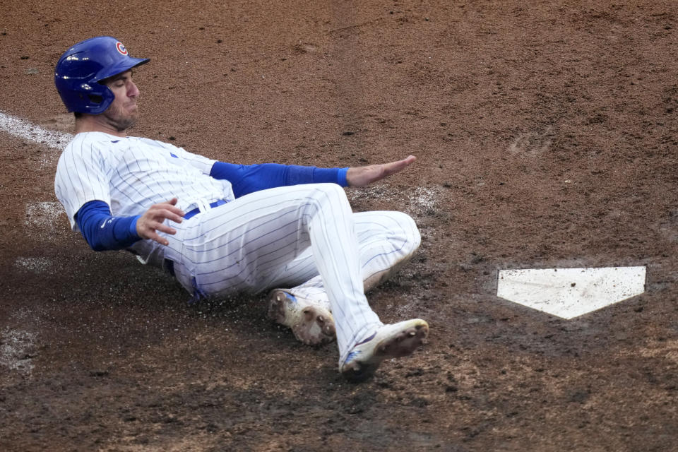 Chicago Cubs' Cody Bellinger scores on Christopher Morel's single off Atlanta Braves starting pitcher Bryce Elder during the fifth inning of a baseball game Saturday, Aug. 5, 2023, in Chicago. (AP Photo/Charles Rex Arbogast)