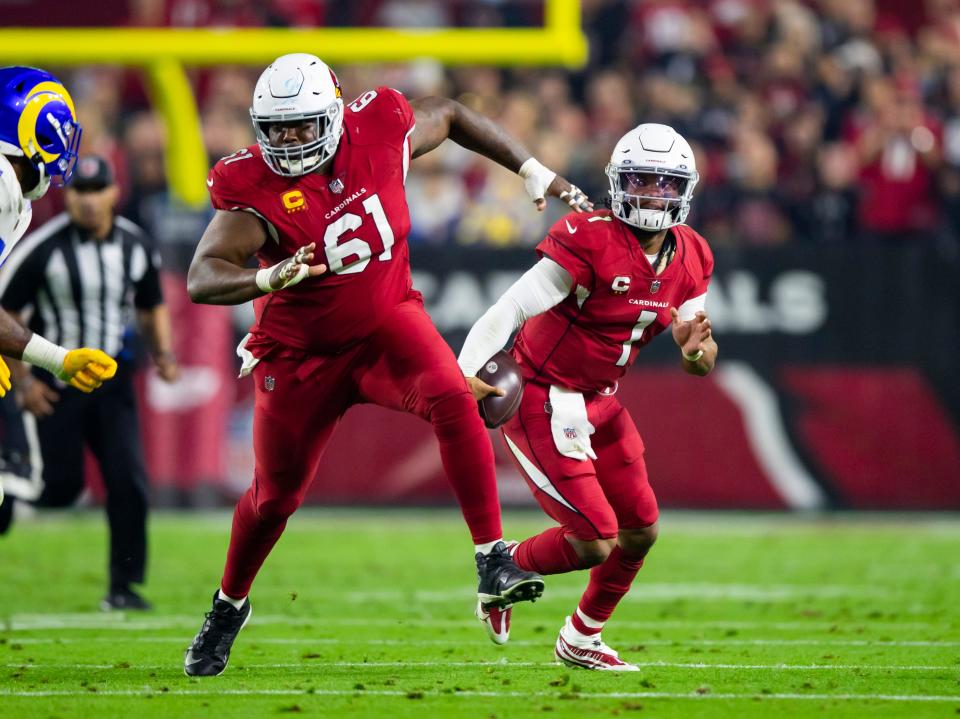 Dec 13, 2021; Glendale, Arizona, USA; Arizona Cardinals center Rodney Hudson (61) blocks for quarterback Kyler Murray (1) against the Los Angeles Rams at State Farm Stadium.