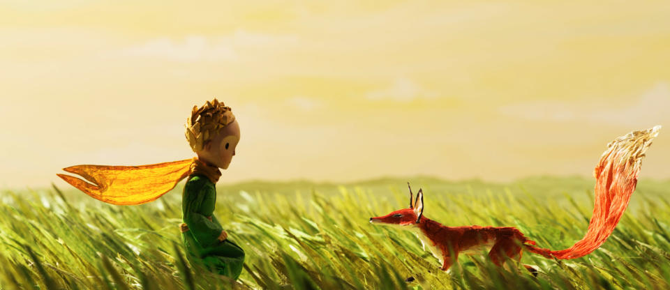 A scene from "The Little Prince" with the little boy and a fox