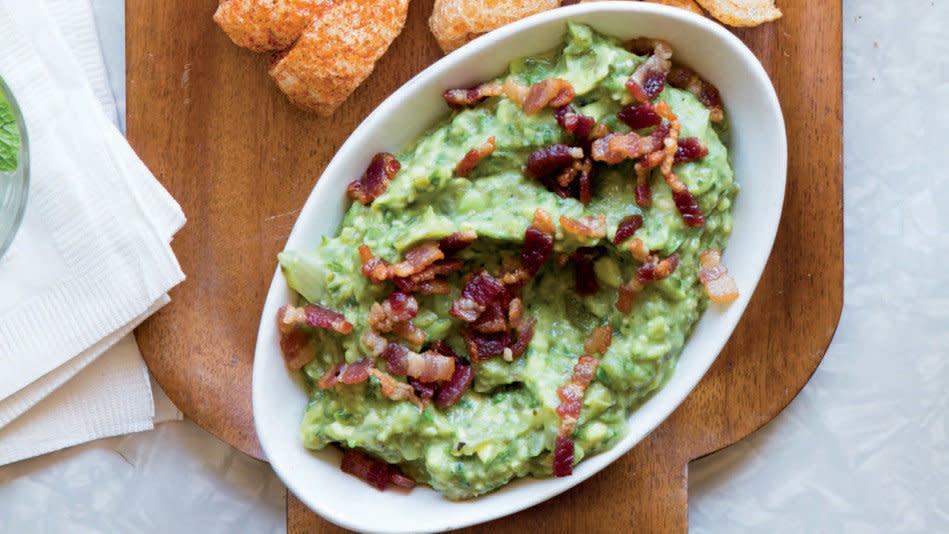 Bacon and guacamole are two foods that tend to go over really well with pretty much anyone -- which is why this brilliant dip combining both is a shoo-in for any buffet table. The recipe also features roasted jalape&ntilde;os, onions, garlic and tomatillos, which give the spread an extra rich and smoky flavor. <br /><br /> <strong>Get the recipe: <a href="http://www.oprah.com/food/Bacon-Guacamole-Salsa-Verde-Dip-Recipe" target="_blank">Bacon-Guacamole Salsa Verde Dip</a></strong>