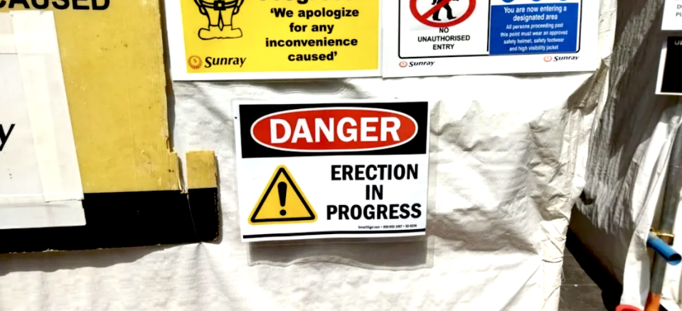 danger erection in progress sign