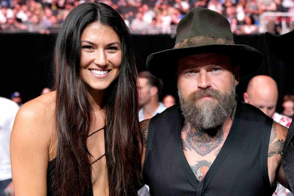 Cooper Neill/Zuffa LLC/Getty Recording artist Zac Brown (C) of the Zac Brown Band is seen in attendance with a guest and Donald "Cowboy" Cerrone (R) during the UFC Fight Night event at Moody Center on June 18, 2022 in Austin, Texas.