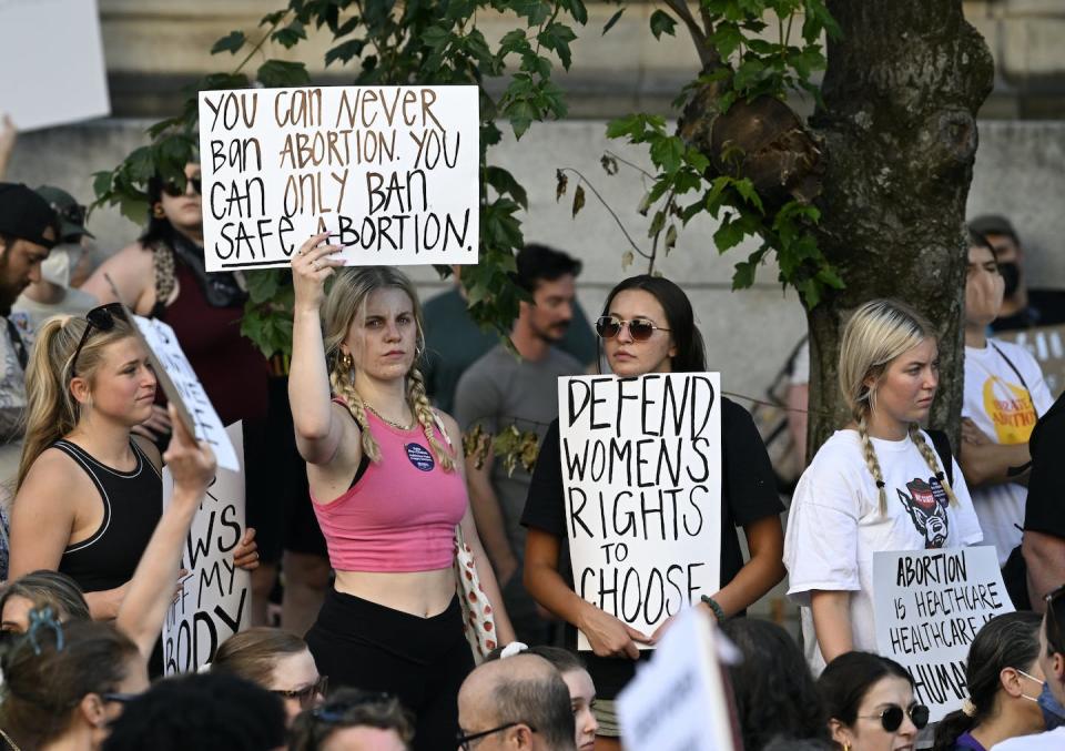 Protesters in Raleigh, N.C., object to the Supreme Court’s Dobbs ruling on June 25, 2022. <a href="https://www.gettyimages.com/detail/news-photo/abortion-rights-demonstrators-gather-to-protest-against-the-news-photo/1241513344?phrase=north%20carolina%20abortion&adppopup=true" rel="nofollow noopener" target="_blank" data-ylk="slk:Peter Zay/Anadolu Agency via Getty Images;elm:context_link;itc:0;sec:content-canvas" class="link ">Peter Zay/Anadolu Agency via Getty Images</a>