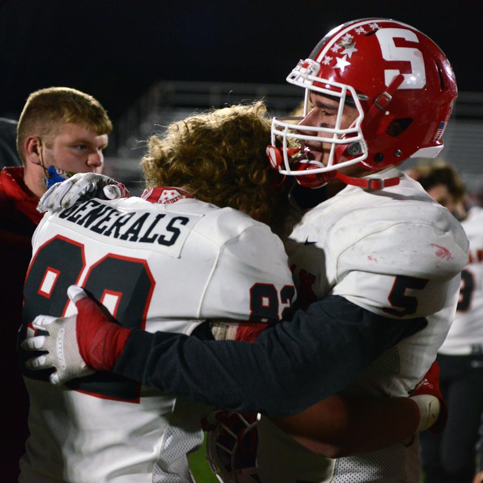 Seniors Tyler Talbot, left, and Shay Taylor console each other following Sheridan's 10-6 loss to Columbus Hartley on Friday night in a Division III, Region 11 semifinal on Oct. 30, 2020, in Columbus. Taylor was a first-team All-Ohioan for the Generals who is now in line for a larger role as a veteran linebacker for Ohio.