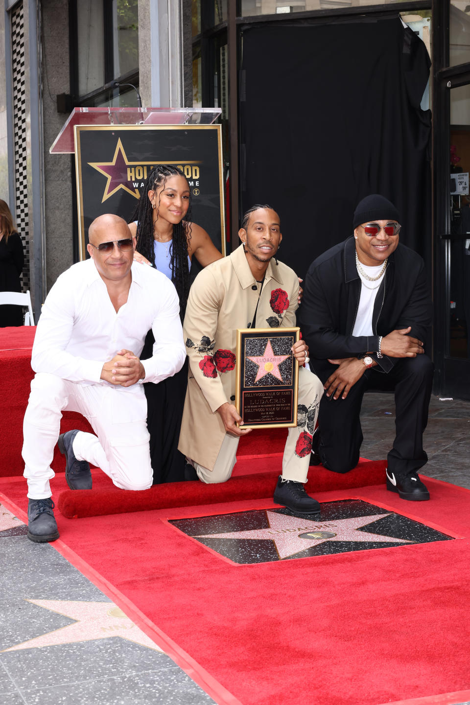 Vin Diesel, Karma Bridges, Ludacris, and LL Cool J posing for picture.
