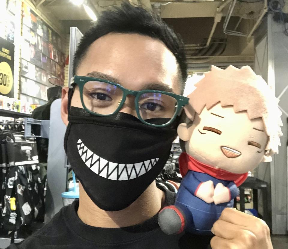 Author with an anime plush toy