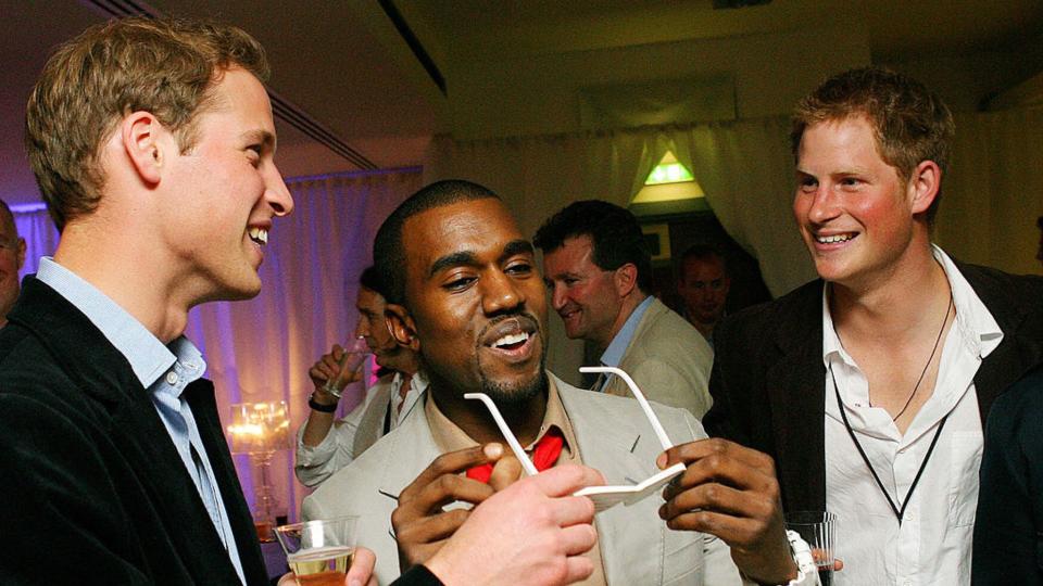 rapper Kanye West (c) shares a joke with Prince Harry (R) and Prince William (L) at Wembley Arena in 2007