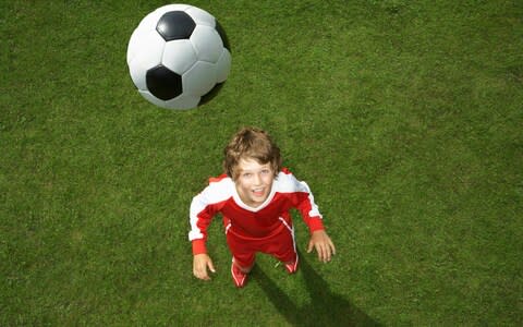 A child prepares to head the ball - Credit: Tim Macpherson