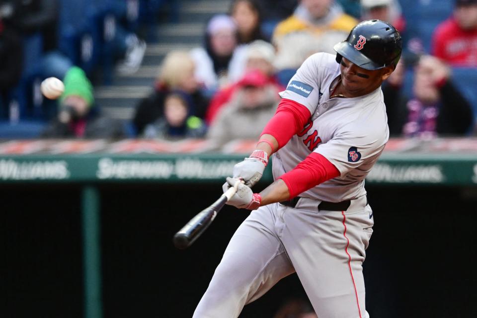 Apr 24, 2024; Cleveland, Ohio, USA; Boston Red Sox designated hitter Rafael Devers (11) hits a home run during the fifth inning against the Cleveland Guardians at Progressive Field. Mandatory Credit: Ken Blaze-USA TODAY Sports