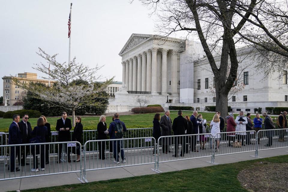 People wait outside the Supreme Court to hear oral arguments on mifepristone on March 26, 2024. <a href="https://www.gettyimages.com/detail/news-photo/people-wait-in-line-outside-us-supreme-court-to-hear-oral-news-photo/2107843290?adppopup=true" rel="nofollow noopener" target="_blank" data-ylk="slk:Drew Angerer/AFP via Getty Images;elm:context_link;itc:0;sec:content-canvas" class="link ">Drew Angerer/AFP via Getty Images</a>