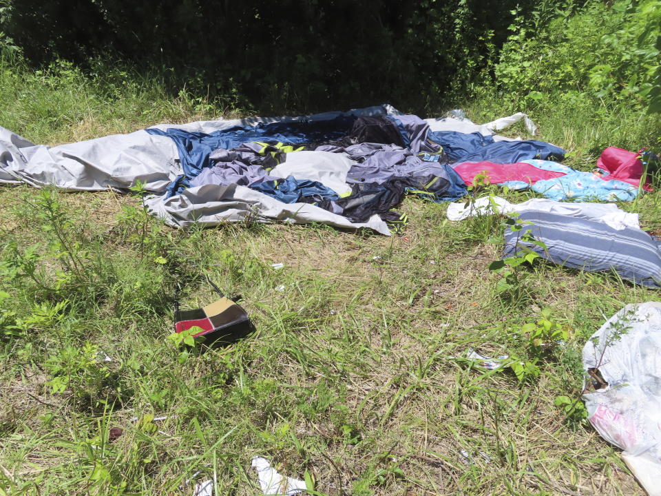 Trash, clothing and other supplies lie on the ground in a homeless encampment in Atlantic City, N.J., on Monday, July 1, 2024, the date city officials announced implementation of programs to address homelessness. (AP Photo/Wayne Parry)