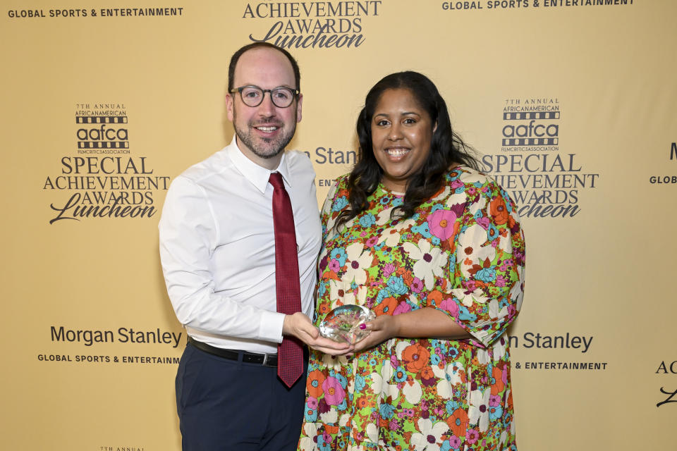 Ekrem Dimbiloglu and Catherine McDaniel of Delta Airlines pose with the Film Advocate Award at the AAFCA Special Achievement Awards Luncheon held at the Los Angeles Athletic Club on March 3, 2024 in Los Angeles, California.