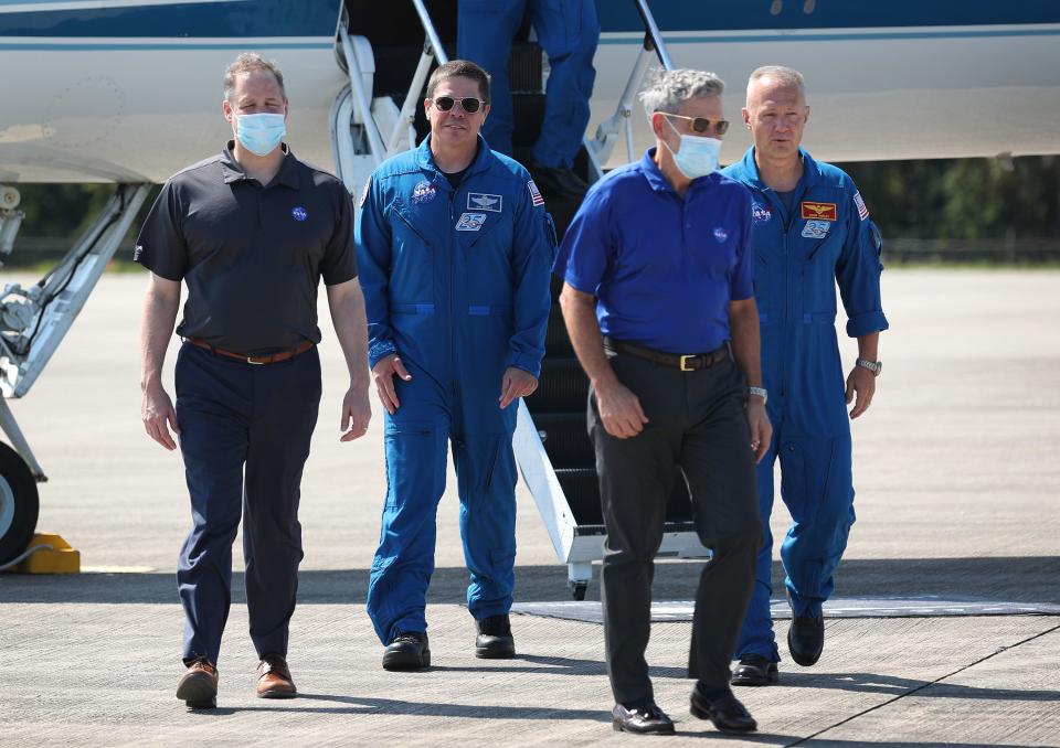 From left, NASA Administrator Jim Bridenstine, astronaut Bob Behnken, Kennedy Space Center Director Robert Cabana and astronaut Doug Hurley at Cape Canaveral, Florida, on May 20, 2020.