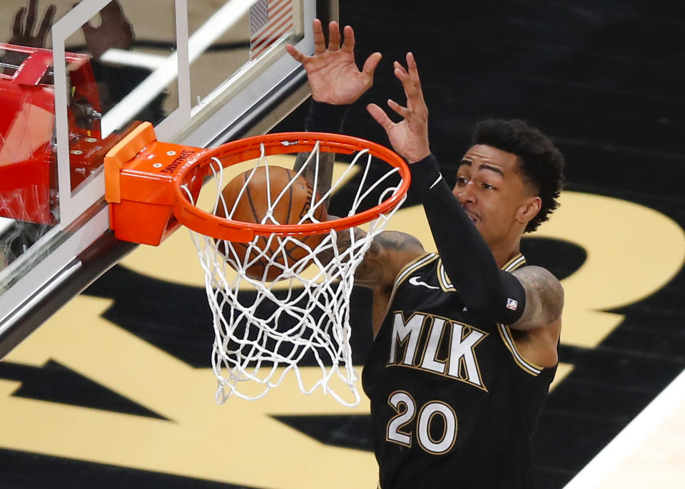 John Collins and the Atlanta Hawks were unable to reach an extension in December. (Todd Kirkland/Getty Images)