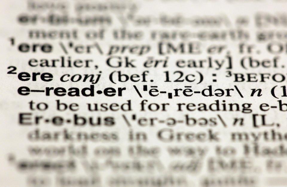 The entry "e-reader," photographed in New York, Friday, Aug. 10, 2012, is one of the 15 new additions in the 11th edition of Merriam-Webster's Collegiate Dictionary. (AP Photo/Richard Drew)