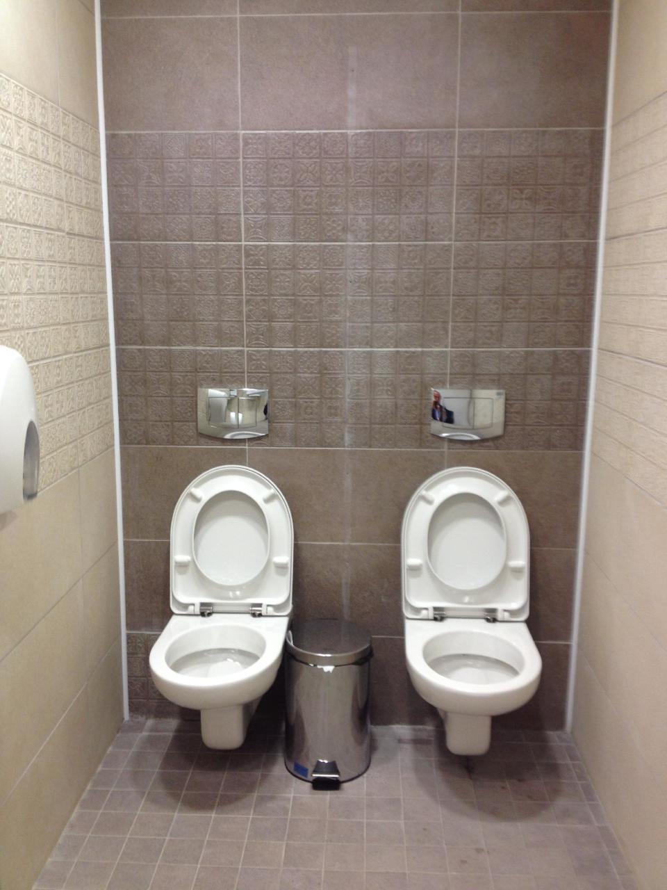 This photo taken on Friday Jan. 17, 2014, shows two toilets at the cross-country skiing and biathlon center for next month’s Olympics in Sochi, Russia. Although two toilets and only one stall like this are not common in Russia, social media users have responded by posting other pictures of toilets standing side by side. One said this was standard at Russian soccer stadiums. (AP Photo/Steve Rosenberg, BBC)