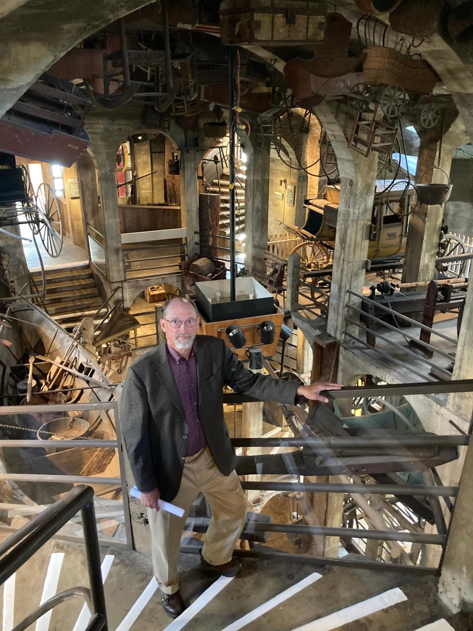 Cory Amsler stands in the grand hall amid the items on display at the Mercer Museum in Doylestown. Among the macabre items on display is the gallows once shared by Bucks and Northampton counties, and last used in Bucks in 1914 to hang convicted murderer James Linzi.