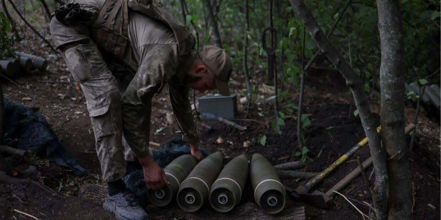 A Ukrainian soldier prepares shells for the M777 howitzer