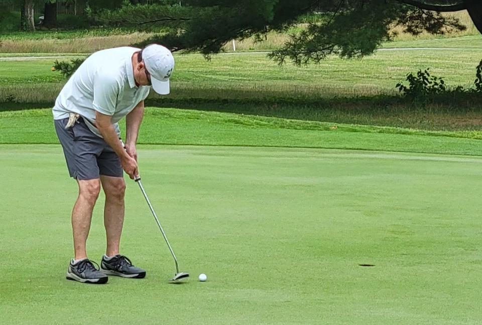 Jim Alexander sends his putt toward the hole on No. 10 at Cascades Golf Course during his Senior Championship flight match on Saturday, July 8, 2023.