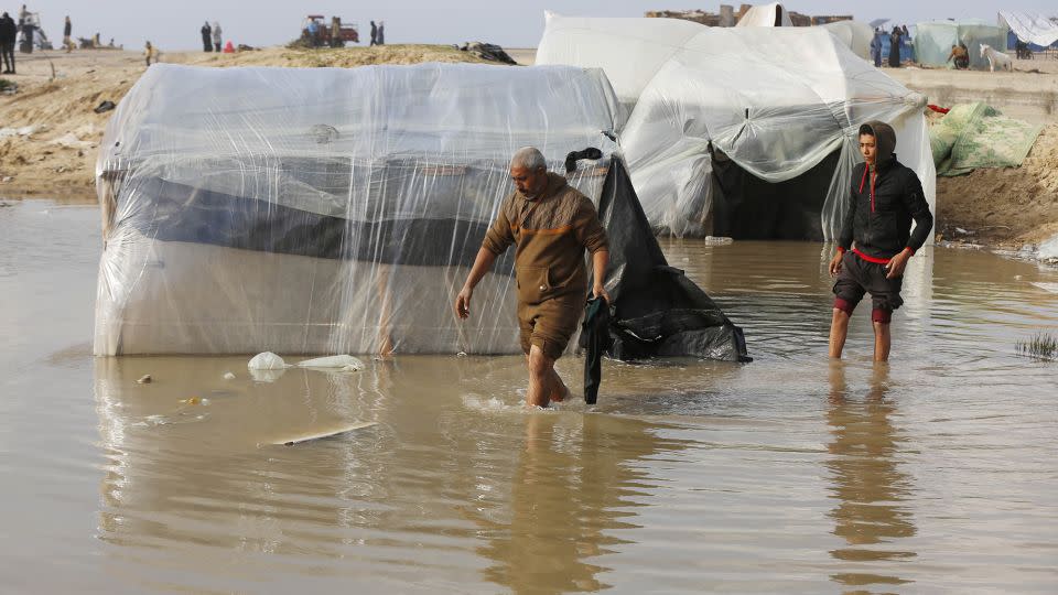 Heavy rain floods makeshift tents in Deir Al-Balah, in central Gaza, on January 24. Palestinians trying to survive bombardment told CNN winter weather conditions exacerbate dire sheltering conditions. - Ashraf Amra/Anadolu/Getty Images