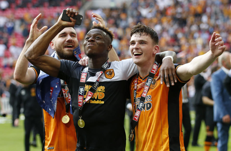 Britain Soccer Football - Hull City v Sheffield Wednesday - Sky Bet Football League Championship Play-Off Final - Wembley Stadium - 28/5/16 (L - R) Hull City's Robert Snodgrass, Moses Odubajo and Andrew Robertson celebrate winning promotion back to the Premier League Action Images via Reuters / Andrew Couldridge Livepic EDITORIAL USE ONLY. No use with unauthorized audio, video, data, fixture lists, club/league logos or "live" services. Online in-match use limited to 45 images, no video emulation. No use in betting, games or single club/league/player publications. Please contact your account representative for further details.